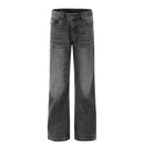 Washed and ground white distressed jeans